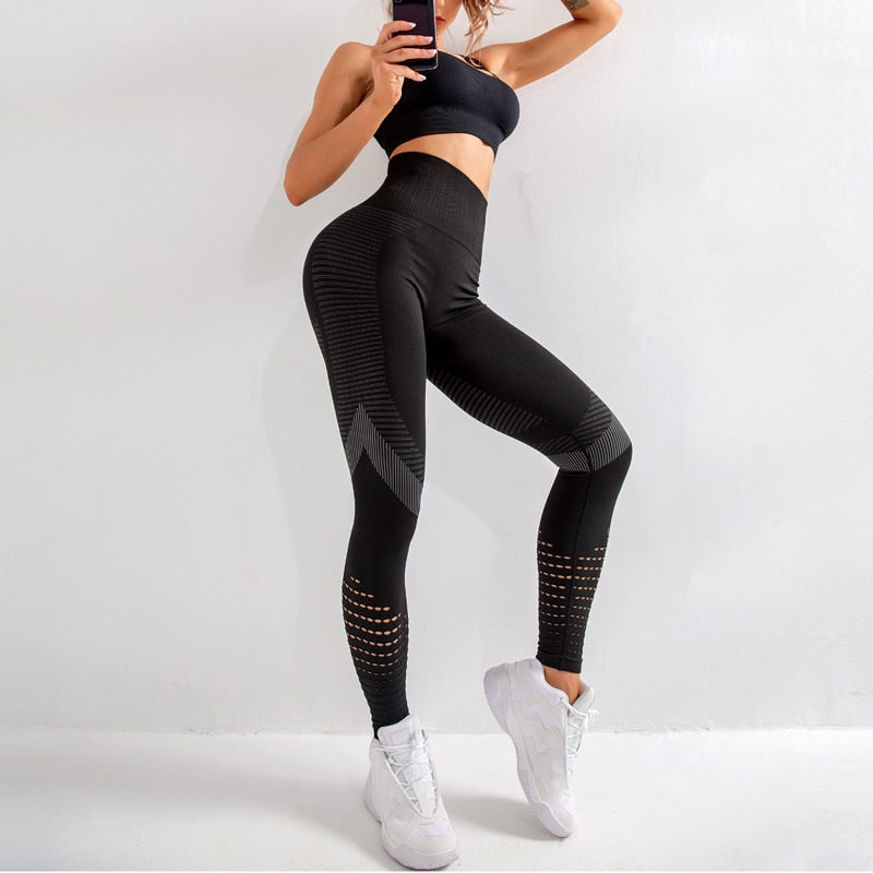 Fitness woman in leggings on gray background. Athletic girl with